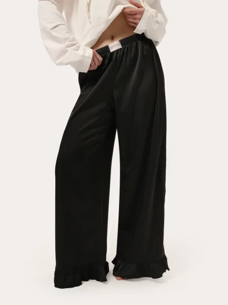 Pantaloni neri con volant