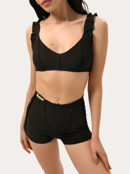 Completo in maglia a costine con cuciture decorative — nero