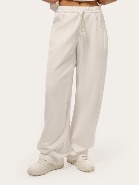 Pantaloni wide-leg color latte in tessuto felpato a tre fili