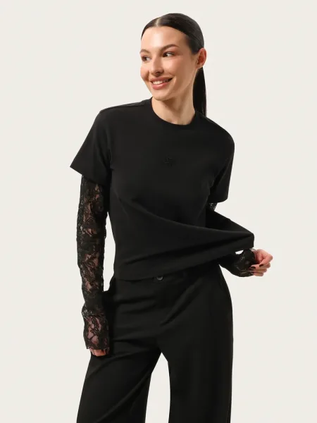 Maglia nera a maniche lunghe con maniche in pizzo e ricamo
