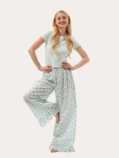 Pantaloni estivi leggeri color menta con volant a fiori