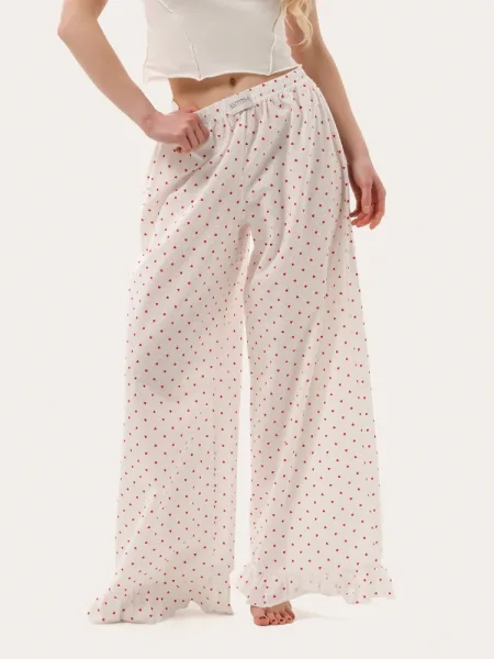 Pantaloni estivi color latte con rouches e motivo a cuori