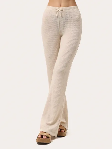 Pantaloni a zampa in maglia beige